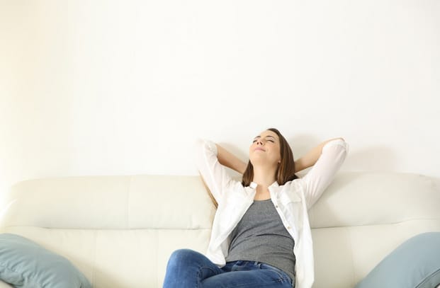 A woman enjoys a cool, comfortable room